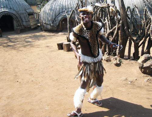 A man in Zulu warior dress.